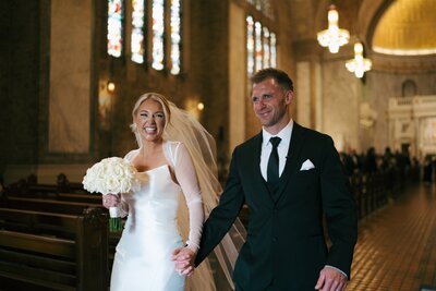 bride and groom exiting the church after ceremony in Philadelphia