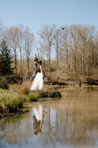 Bride and groom walking in a forest in Cuyahoga Valley National Park.