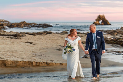 This couple got married on the beach in southern California at sunset.