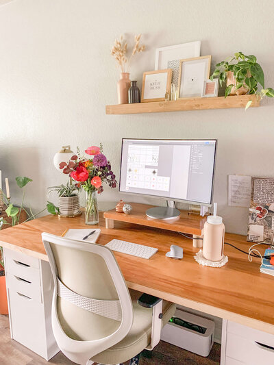 Image of boho home office with  desk chair and desk with desk, chair, shelves, and monitor