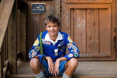 Culver Summer Camp picture with camper sitting at Woodcraft Cabin by Always Images.