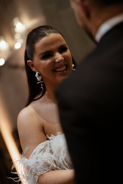 bride and groom kidding under veil