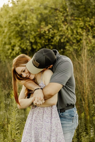 Iowa couple having fun during a golden hour photoshoot