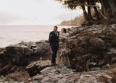Bride and Groom pose on the shores of Lake Superior near Duluth, Minnesota wedding photo