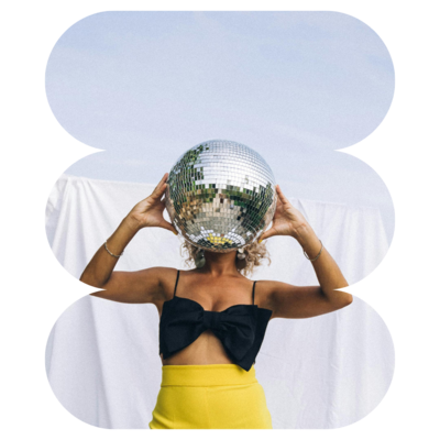 Girl holds disco ball over face