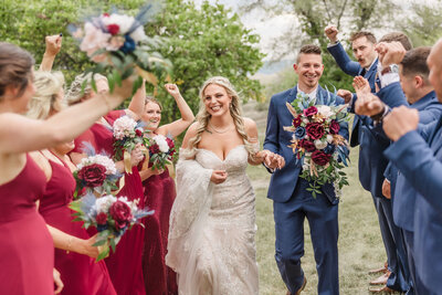 Bride and Groom celebrate with their bridal party during their wedding in Peoria, Illinois.