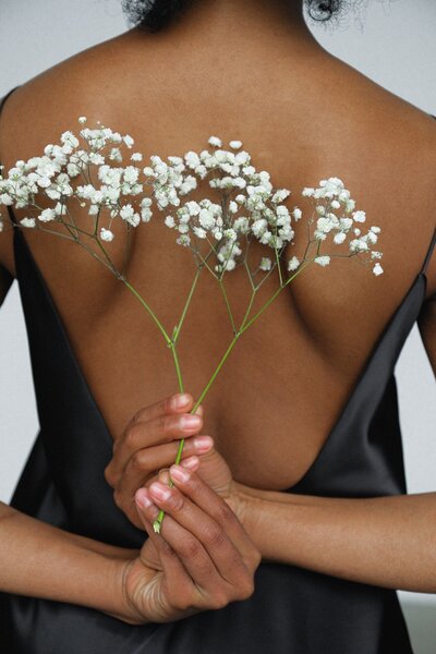 Woman Back with Baby Breath Flower Bunch