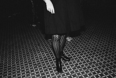 Mira Park Photography NY based wedding photographer black and white wedding reception black and white photo of woman in lace tights at The Bowery Hotel in NYC NY