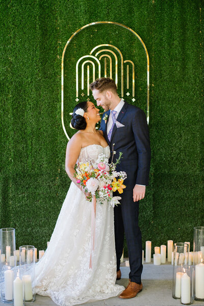 interracial-wedding-couple-kissing-at-modern-wedding-ceremony-Calgary-AB