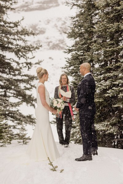 Capture the essence of romance with a photo of the bride and groom embracing at Fairmont Banff Springs Hotel. A perfect moment of love and elegance on their wedding day.