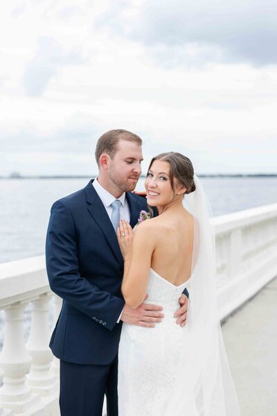 Btide and groom embracing at their Tampa wedding