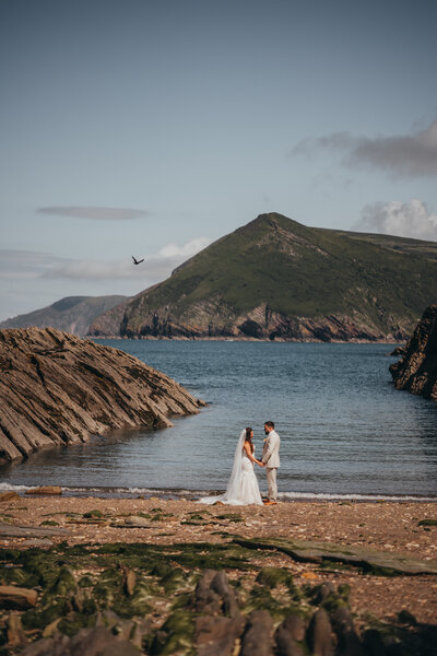 married couple look out to sea