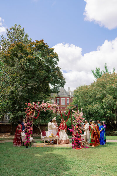 couple cheering as they exit their indian wedding ceremony at the Branch Museum