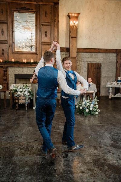 Two grooms doing their first dance