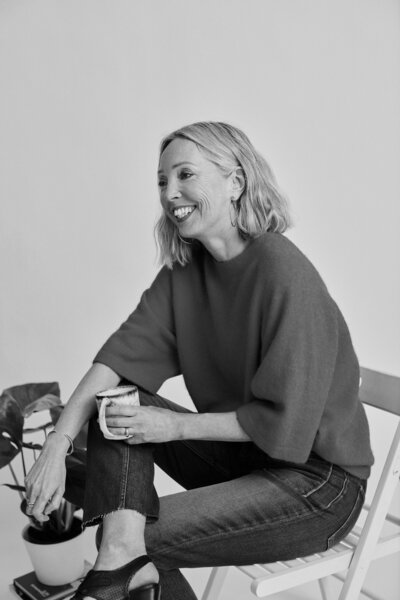 Woman smiling with coffee