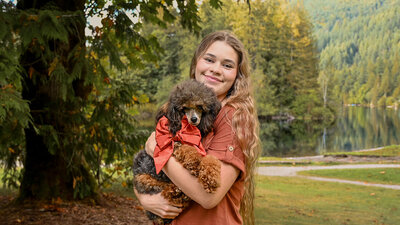 Desiree holding a Poodle Puppy