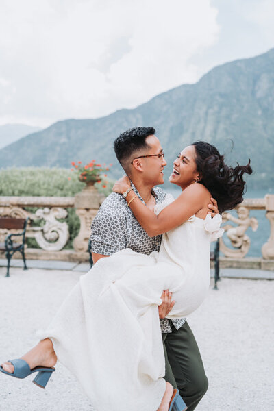 man kissing woman's forehead