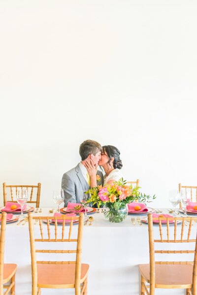 The best Charlotte wedding photographer photo with a bride and groom kissing.