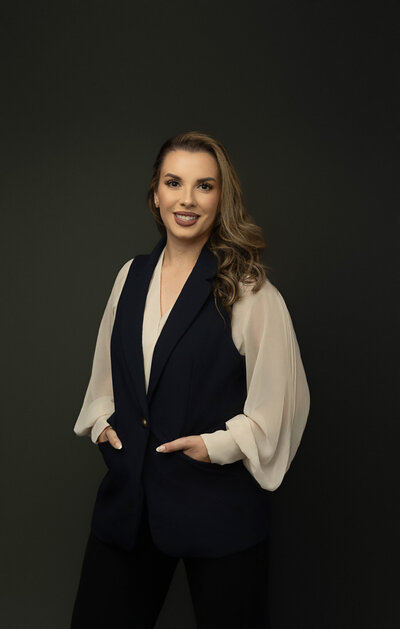 Young professional woman posing for her busines wearing casual outfit in Austin headshot studio