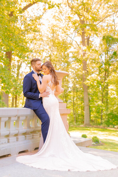 Liriodendron Mansion Wedding Photographer captures a beautiful couples portrait on the back porch of the Liriodendron mansion
