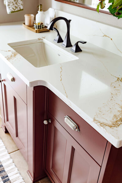 A close up of a quartz slab countertop on a bathroom vanity representing a coastal interior design.