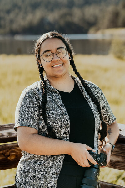 woman smiles with camera