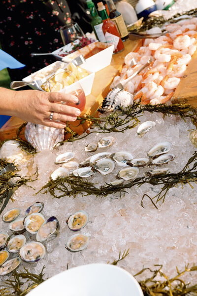 Raw bar with oysters and shrimp at a new england coastal wedding photography