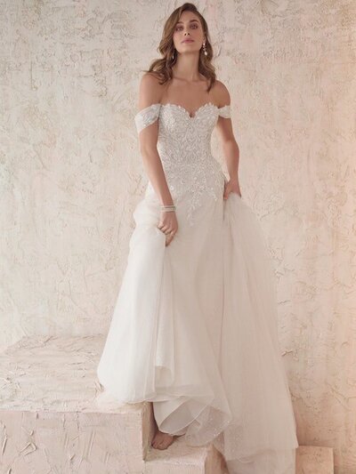 Strapless Sheath Bridal Gown. This is geometric lace for your Vie Bohème. Easy-breezy comfort for ceremony and reception. A strapless sheath bridal gown for your happily ever after.