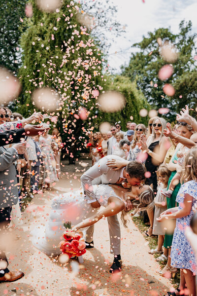 Bride and Groom at Middleton Lodge walled garden in the sunshine