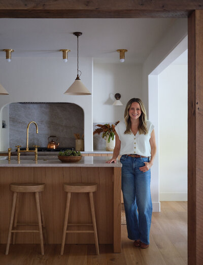 Alexa of Alexa at Home standing at kitchen counter and smiling