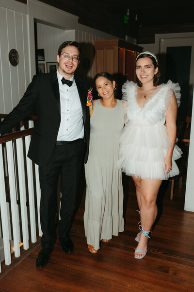 photo of photographer with wedding clients