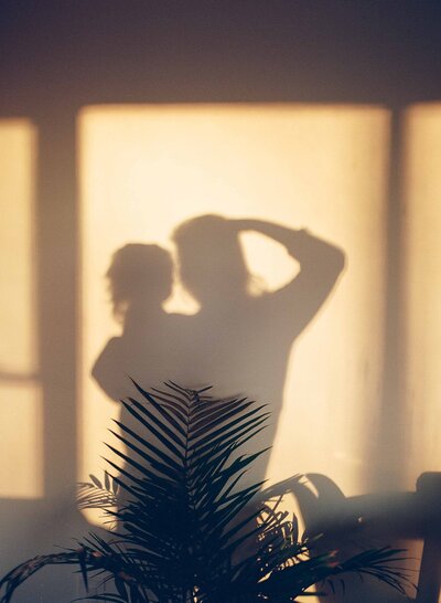 A silhouette of a mom and toddler. 