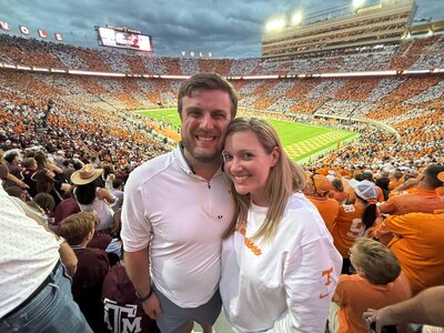 photographer marshall stephens and his wife, shannon, at neyland stadium