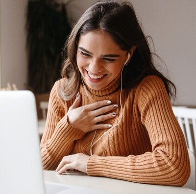 Focused close-up of a woman in white undergarments pinching her belly, highlighting the need for a targeted approach in Charlotte Hunter's Menopause Midsection Makeover program.