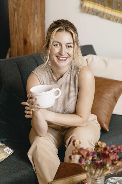 Steph Fuerst sitting with coffee cup