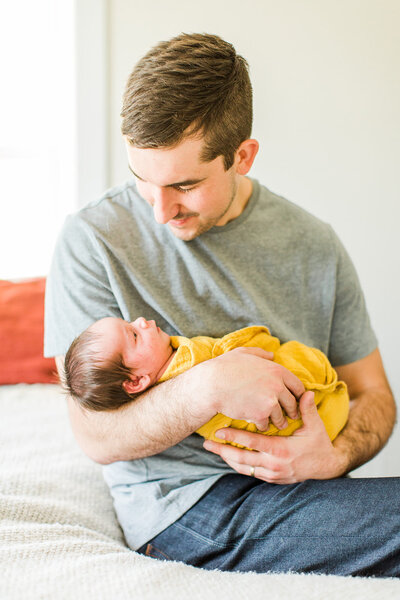 father and newborn daughter