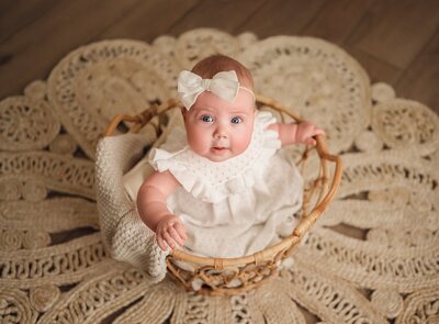 baby girl in a basket