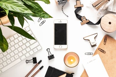 Flat Lay with iPhone, candles, and various accessories