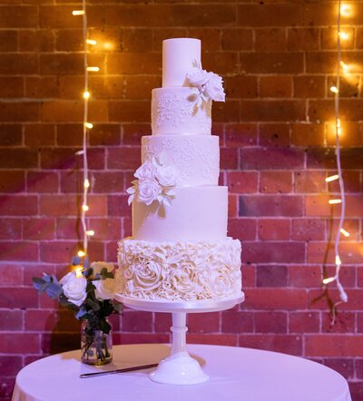 Beautiful 5 tier all white wedding cake in Nottingham