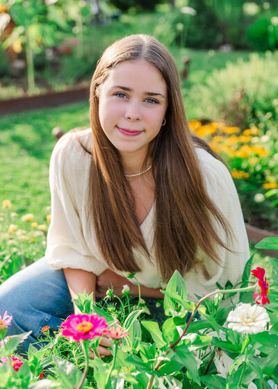 Senior pictures girl in flower garden
