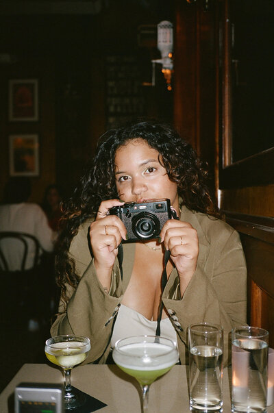 woman holding camera to her face