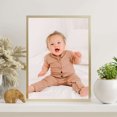 framed photo of baby laughing during Springfield MO baby milestone photography session
