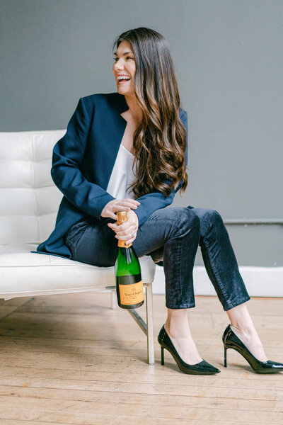 Seattle Washington wedding planner holding champagne