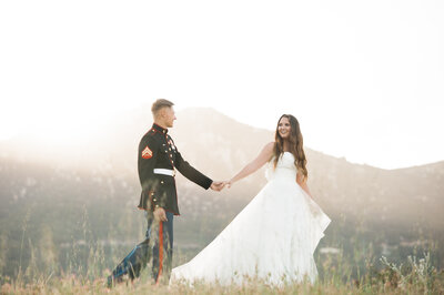 Bride leads marine groom at the top of the hill at Circle Oak Ranch, near San Diego, shot by Nathan Shute Photography