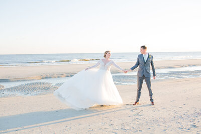 Bride and groom dance on beach, The Citadel Beach Club
