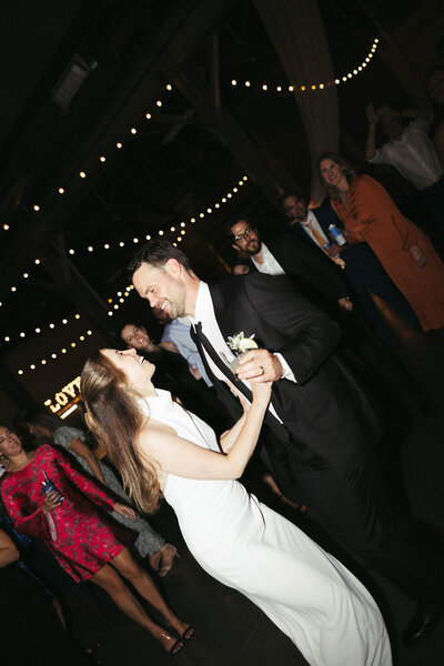 New England couple dancing at their wedding with smiles