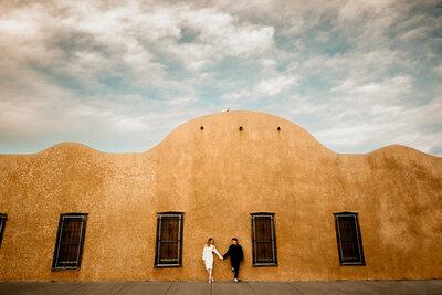 A couple staring lovingly at each other on a sunny day in Northern New Mexico