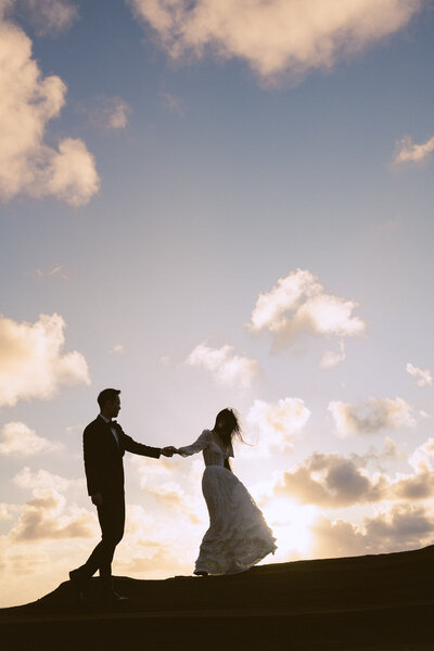 Candid moment of bride and mother captured by Oahu wedding photographer.