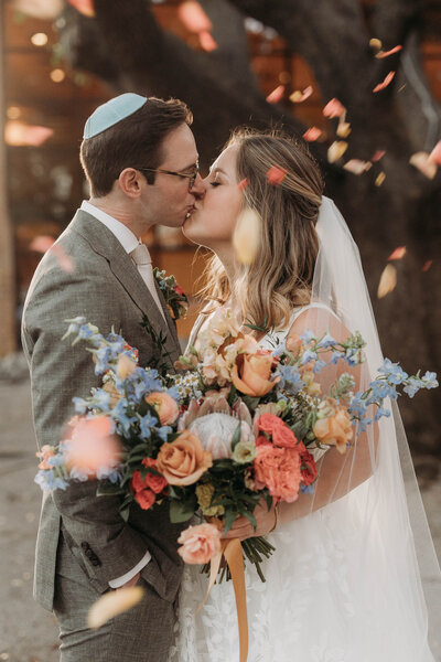 Fun and romantic pink and purple floral arrangements with layered blooms, perfect for a dreamy spring wedding in Dallas.