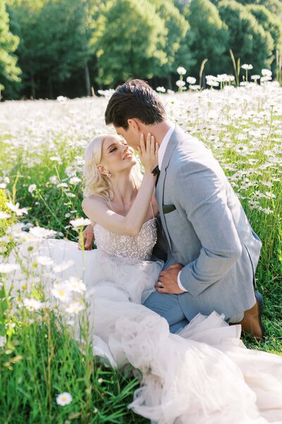 Couple is sitting in flowers